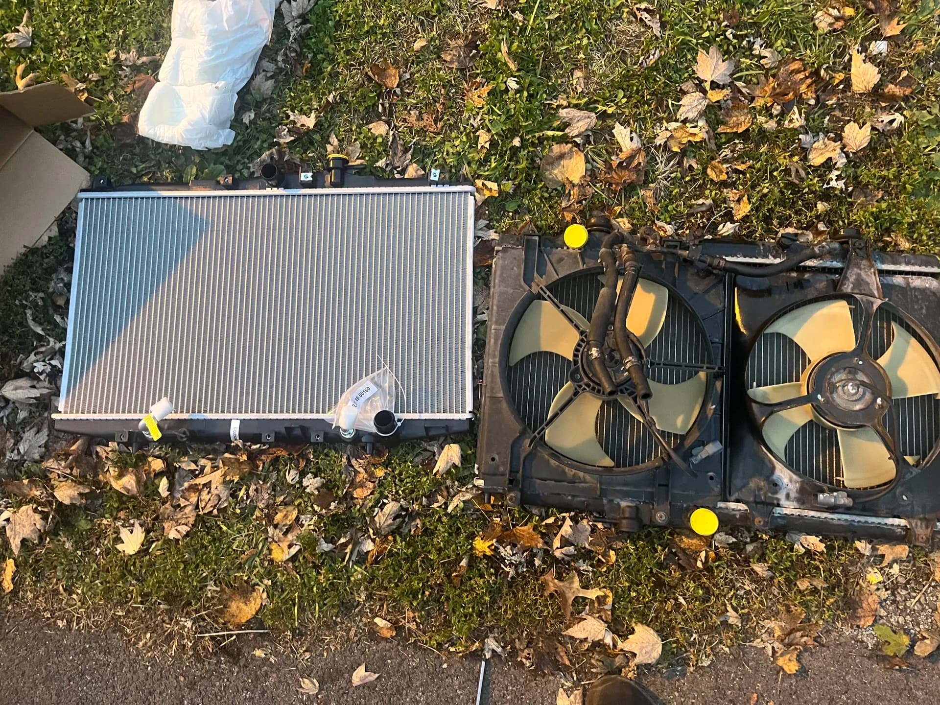 Replacement radiator and cooling fan assembly prepared for installation