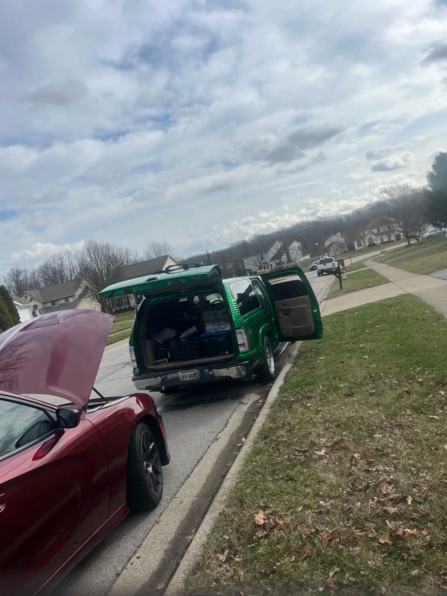 Wayne's mobile service truck parked behind a customer vehicle